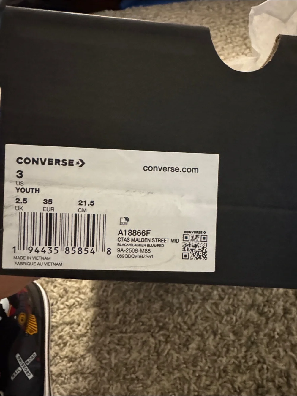 Converse Kids Black High-Top Sneakers with Multi-Color Train Graphic.